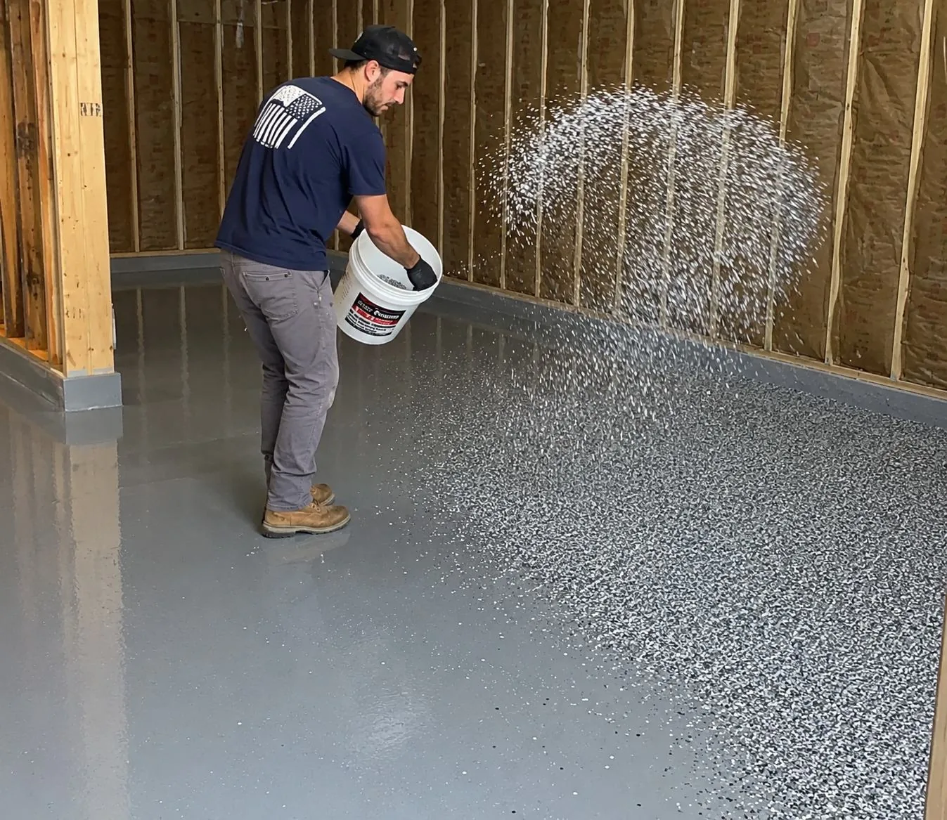 Crew broadcasting decorative flake onto the base coat