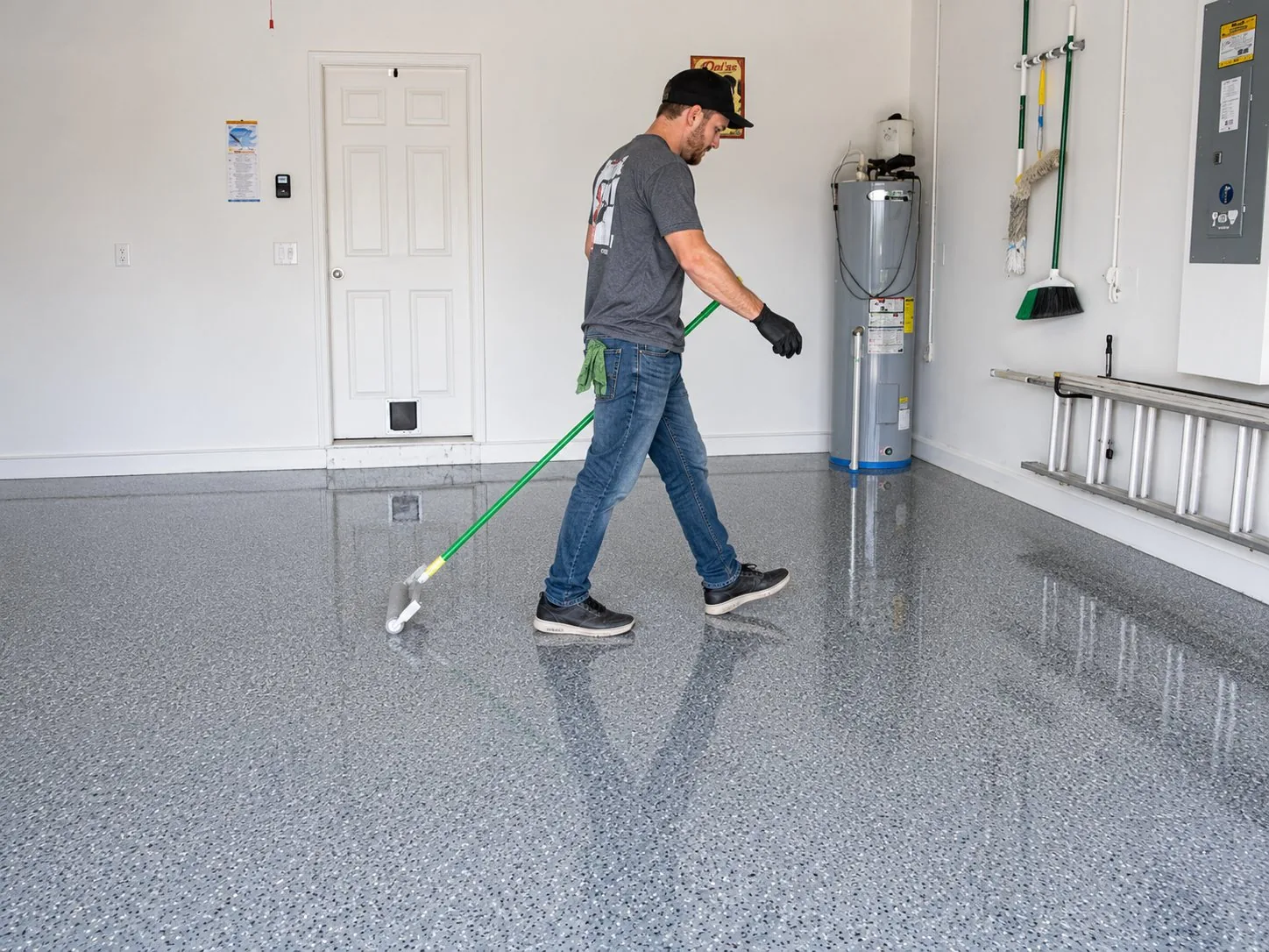 Rolling UV-stable topcoat onto a flake garage floor