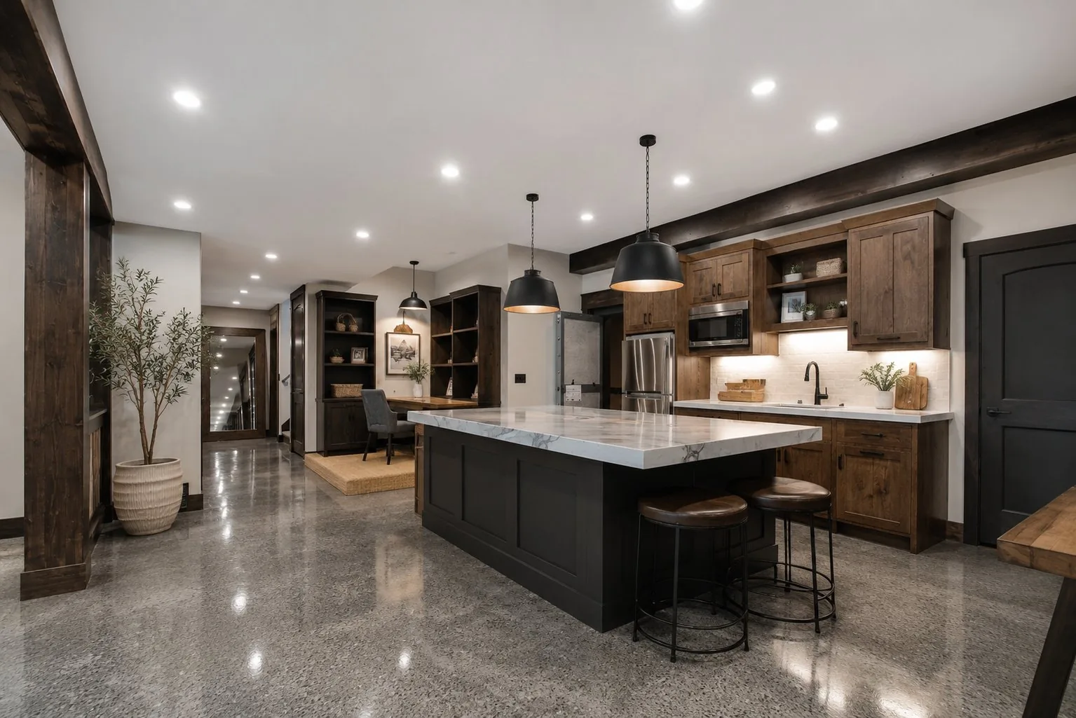 Finished basement kitchen with polished decorative concrete floor